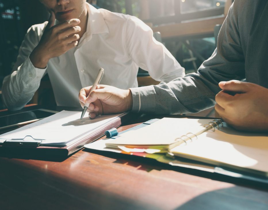 Businessmen and lawyers are discussing business deals. Businessmen and lawyers are discussing business deals.