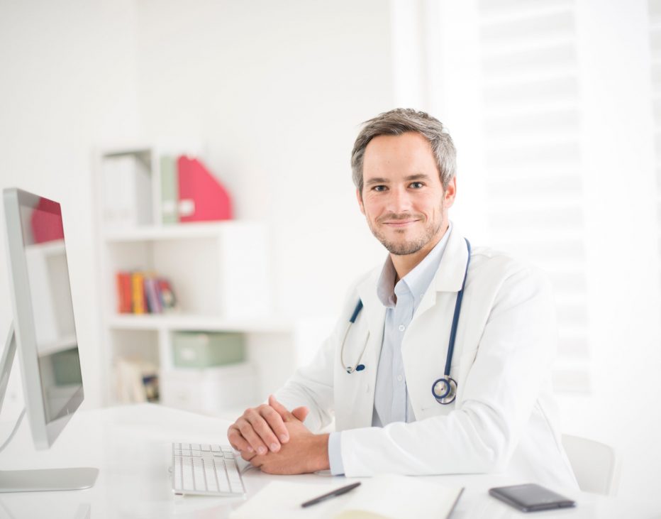 young doctor at his office young doctor at his office